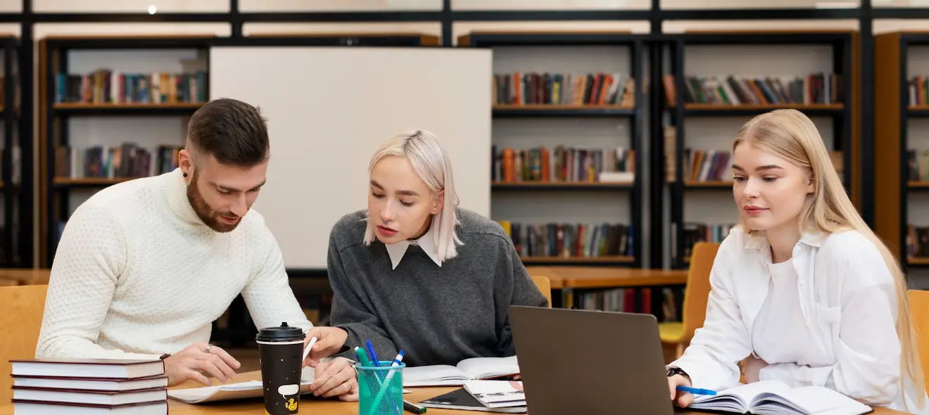 Students collaborating in a Paris university library in an international learning environment