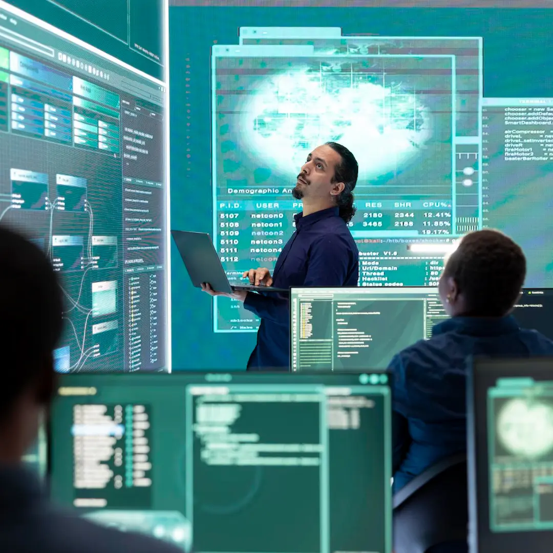 Cybersecurity professionals collaborating on digital systems and international cyber operations