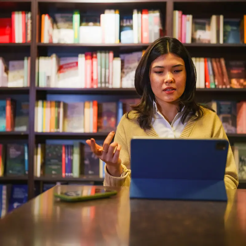 Online Diplomacy Student in Library