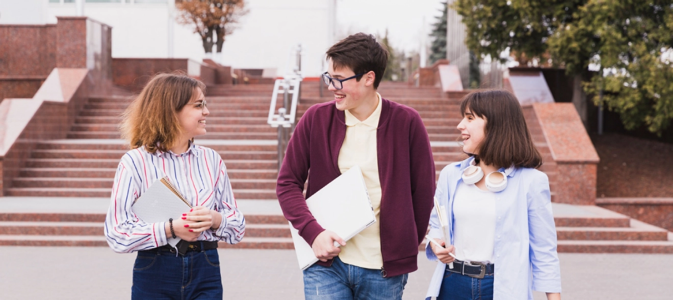 High School Students in Spain Walling Together Holding Books in Hands