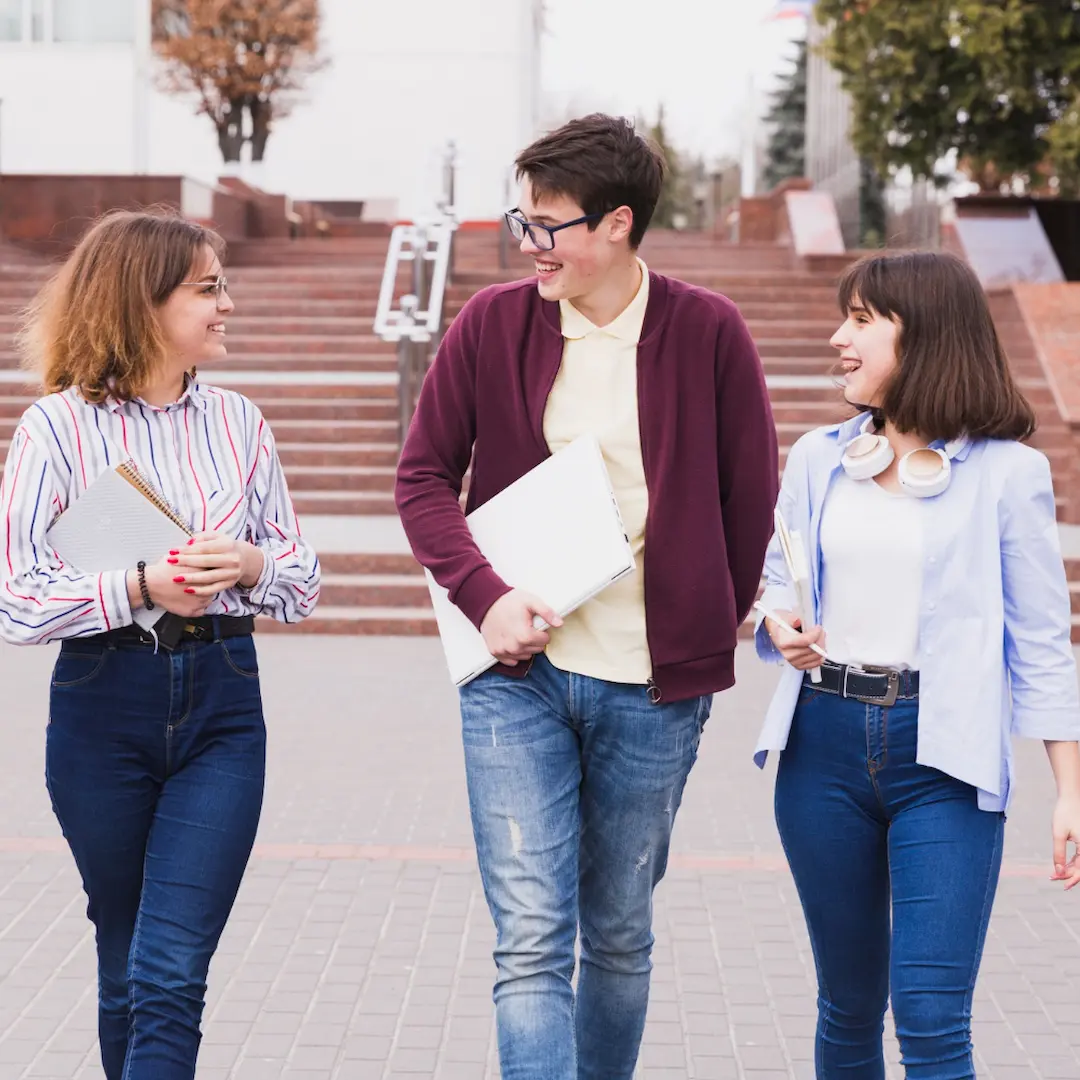 High School Students in Spain Walling Together Holding Books in Hands