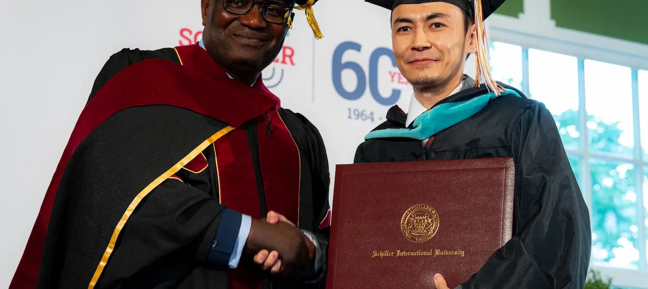 An International Relations Student and Professor During Degree Awards Ceremony