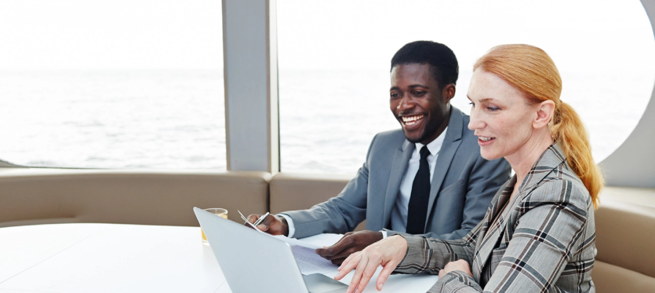 An international business professional meets with a client