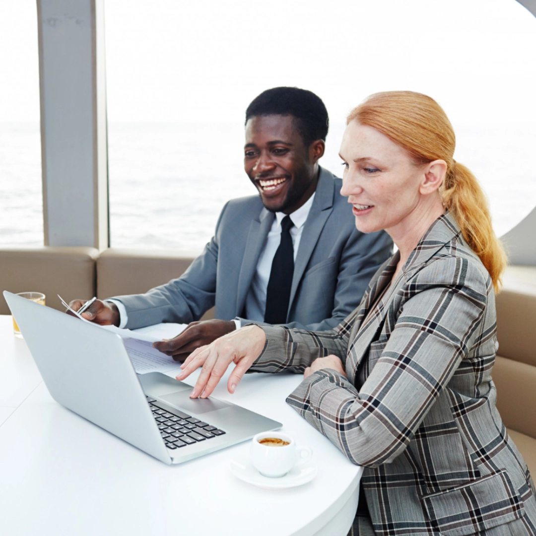 An international business professional meets with a client