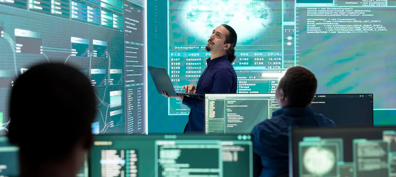Cybersecurity professionals collaborating on digital systems and international cyber operations